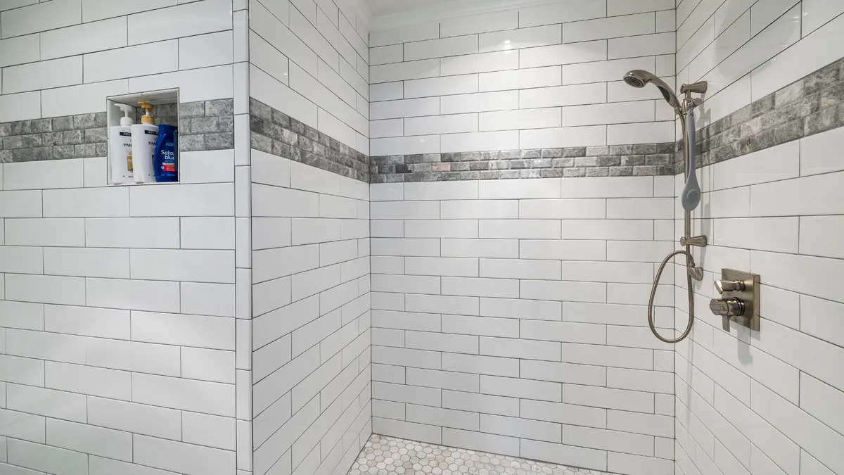 Bathroom Drain Cleaning — professional plumber at work