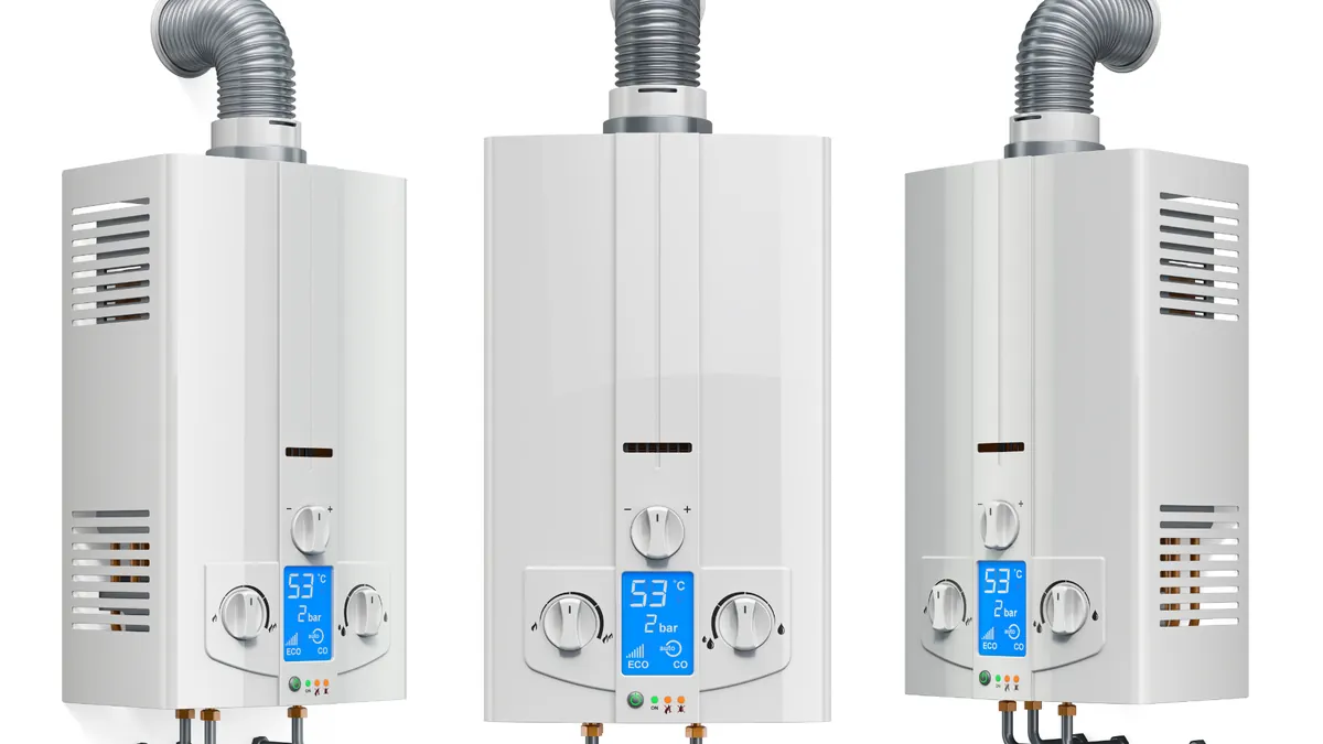 Electric vs. Gas Water Heater — professional plumber at work