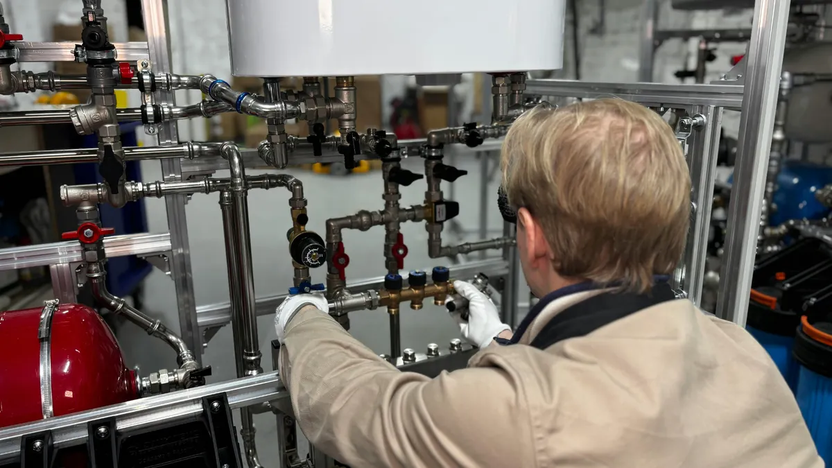 Water Heater Installation — professional plumber at work